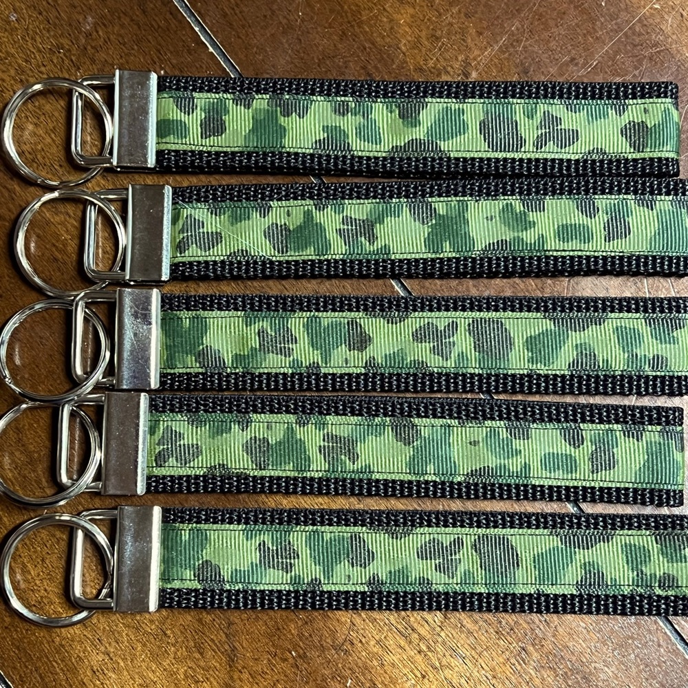 Handcrafted keychain in green camouflage, new without tags.